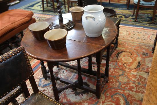 An early 18th century yew wood gateleg table, W.3ft 1in. D.3ft 5in. H.2ft 4in.